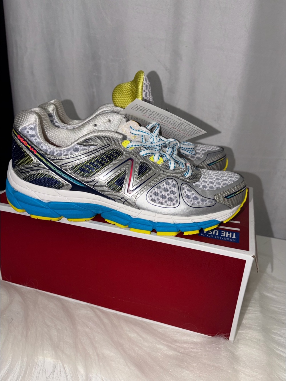 New Balance Silver Athletic Sneakers with Blue & Yellow Accents
